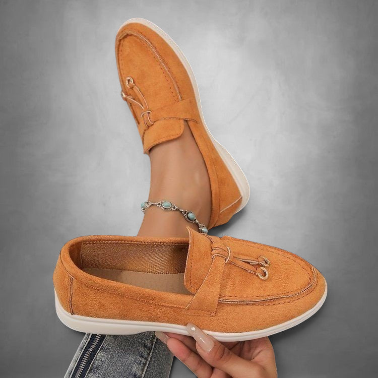 ZOFIA ATELIER orange suede slip-on loafers with tassel detail and flexible driving sole.