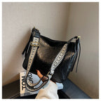 ZOFIA ATELIER PATRYCJA retro crossbody bag in black PU leather with a decorative strap.