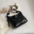 ZOFIA ATELIER PATRYCJA retro crossbody bag in black PU leather with a patterned strap.