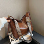 ZOFIA ATELIER PATRYCJA retro crossbody bag in brown PU leather with a patterned strap and gold hardware.
