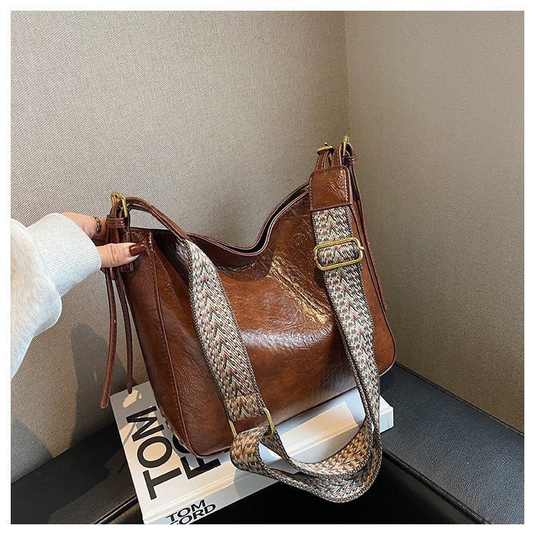 ZOFIA ATELIER PATRYCJA retro crossbody bag in brown PU leather with a patterned strap and gold hardware.