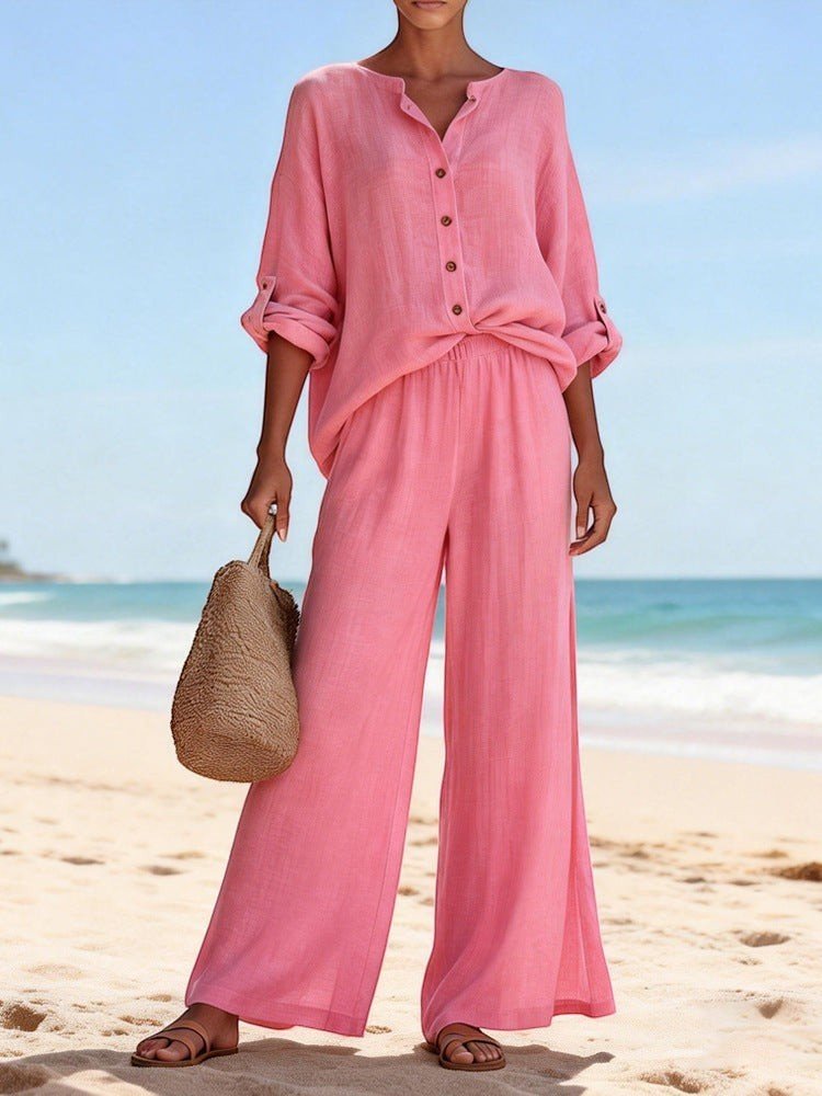 ZOFIA ATELIER pink cotton V-neck long sleeve lounge set with wide-leg pants on a beach.
