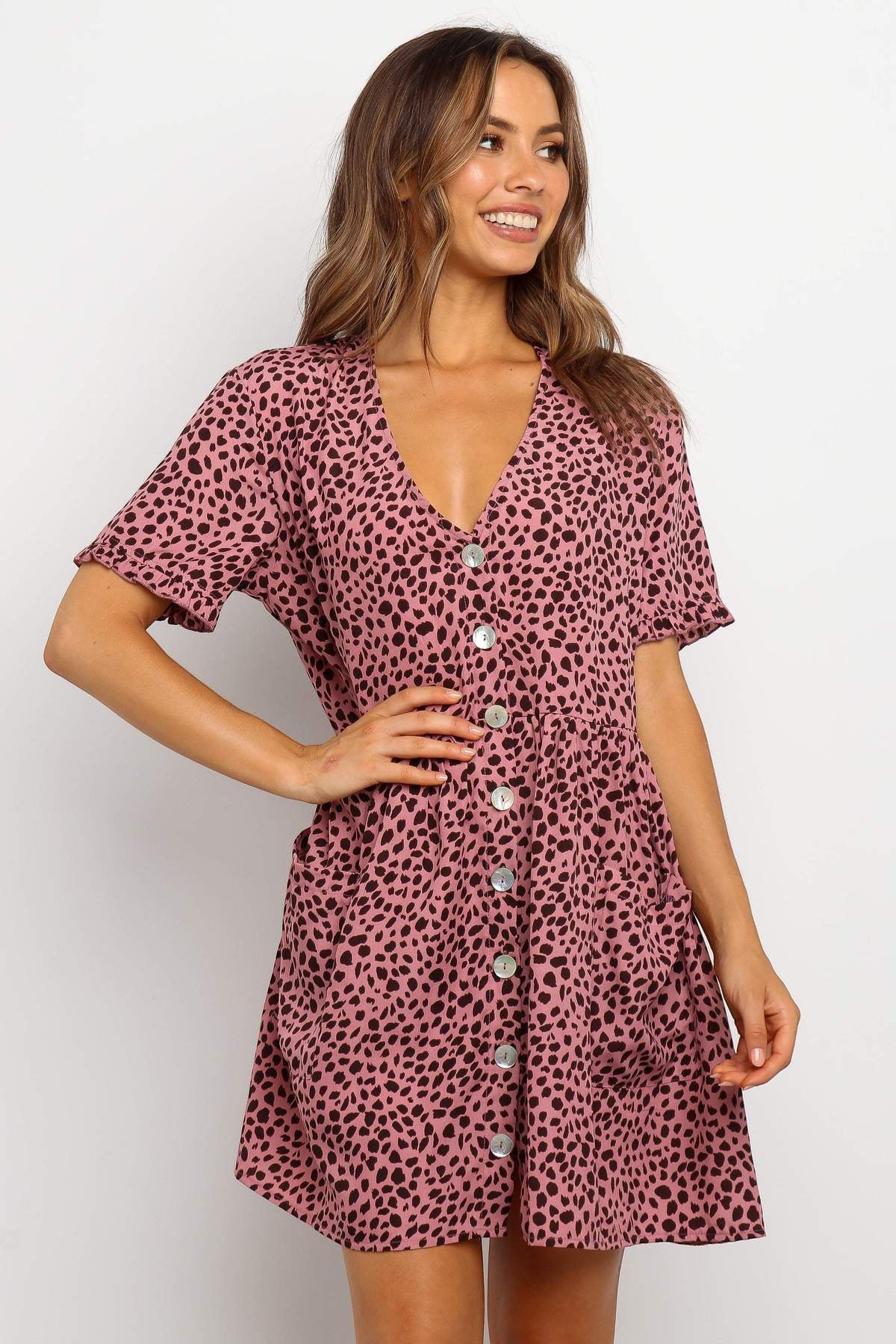 ZOFIA ATELIER pink mini dress with black dot print, V-neck, short sleeves, and button front.