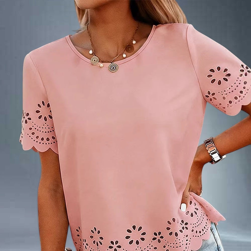 ZOFIA ATELIER pink polyester t-shirt top with crew neck, short sleeves, and embroidered floral cut-out details on sleeves and hem.
