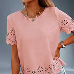 ZOFIA ATELIER pink polyester t-shirt top with crew neck, short sleeves, and embroidered floral cut-out details on sleeves and hem.