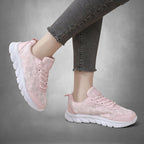 ZOFIA ATELIER pink lace casual running sneakers with white rubber soles and grey frayed jeans
