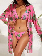ZOFIA ATELIER pink mesh resort swim set with tropical leaf and bird print. Features bikini top, bottom, and long sleeve cover-up.