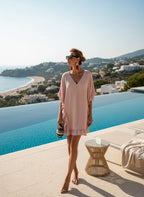 ZOFIA ATELIER pink ruffled V-neck beach dress with batwing sleeves, made of stretch polyester.