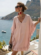 ZOFIA ATELIER light pink ruffled V-neck beach dress with batwing sleeves, made of stretch polyester.