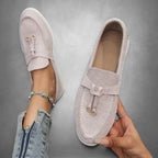 ZOFIA ATELIER light pink suede loafers with tassel detail and bow accent. Comfortable slip-on style.