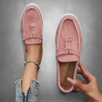 ZOFIA ATELIER pink suede loafers with tassel detail and flexible driving sole. Slip-on style for everyday wear.