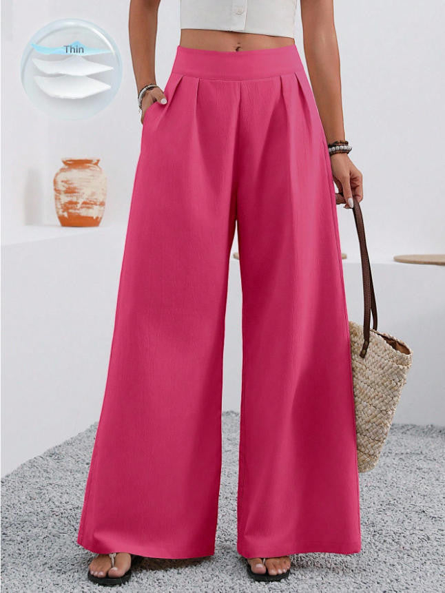 ZOFIA ATELIER high-waisted, wide-leg trousers in bright pink polyester with pockets and a full-length cut.