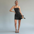 ZOFIA ATELIER black and white plaid bodycon mini dress with spaghetti straps and a mid-waist.