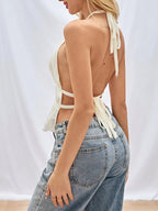 ZOFIA ATELIER URSZULA pleated halter top in cream polyester with a deep V-neck and open back, tied with straps.