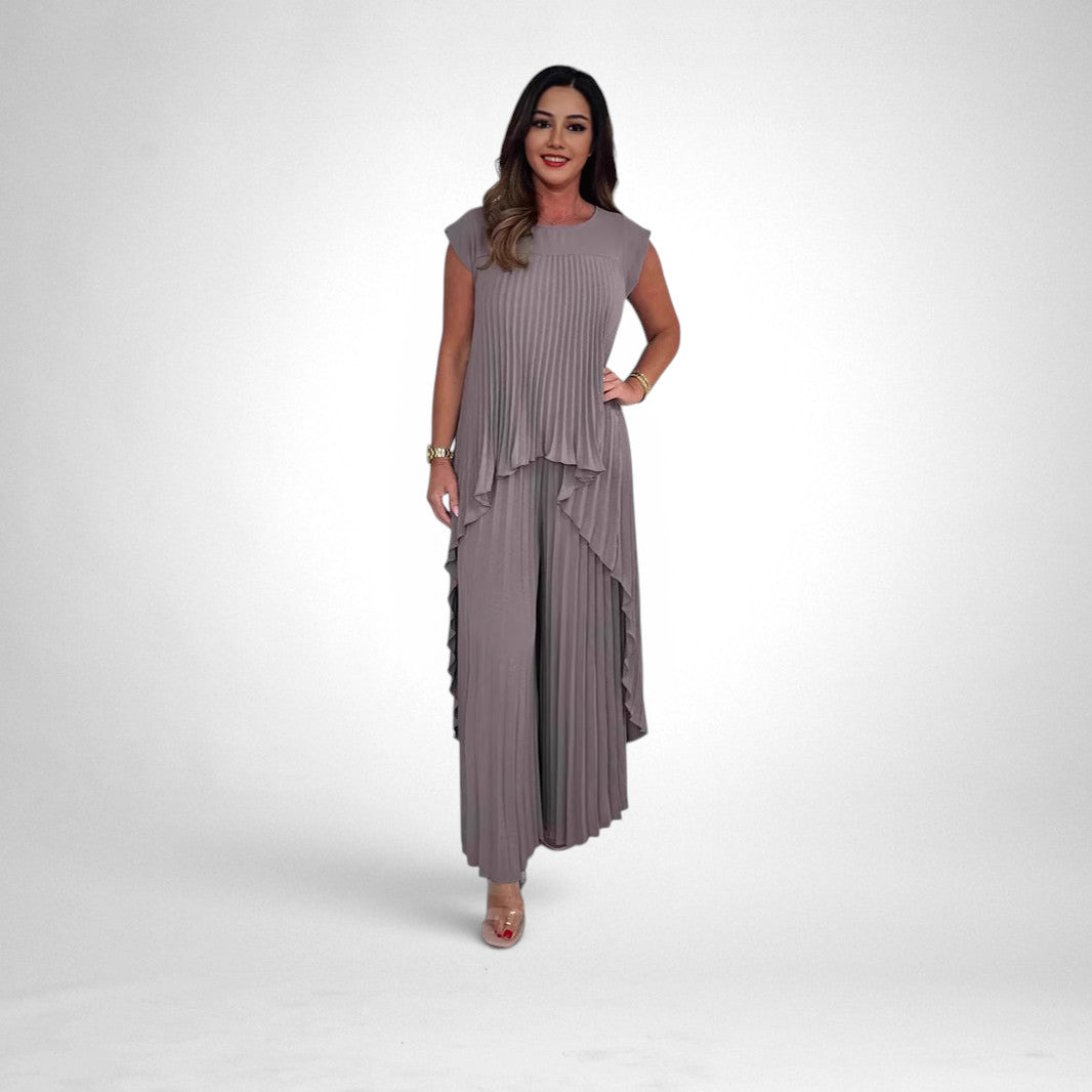 ZOFIA ATELIER grey pleated short sleeve suit with wide leg pants and asymmetrical hem top.