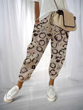 ZOFIA ATELIER beige cotton linen pants with a black abstract circle print, loose fit, drawstring waist.
