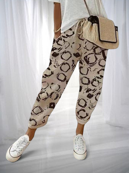 ZOFIA ATELIER beige cotton linen pants with a black abstract circle print, loose fit, drawstring waist.
