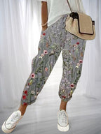 ZOFIA ATELIER gray cotton linen pants with a delicate floral print and loose fit.