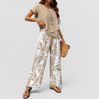 ZOFIA ATELIER women's beige top and wide-leg pants set with a beige and white leaf print. Polyester.