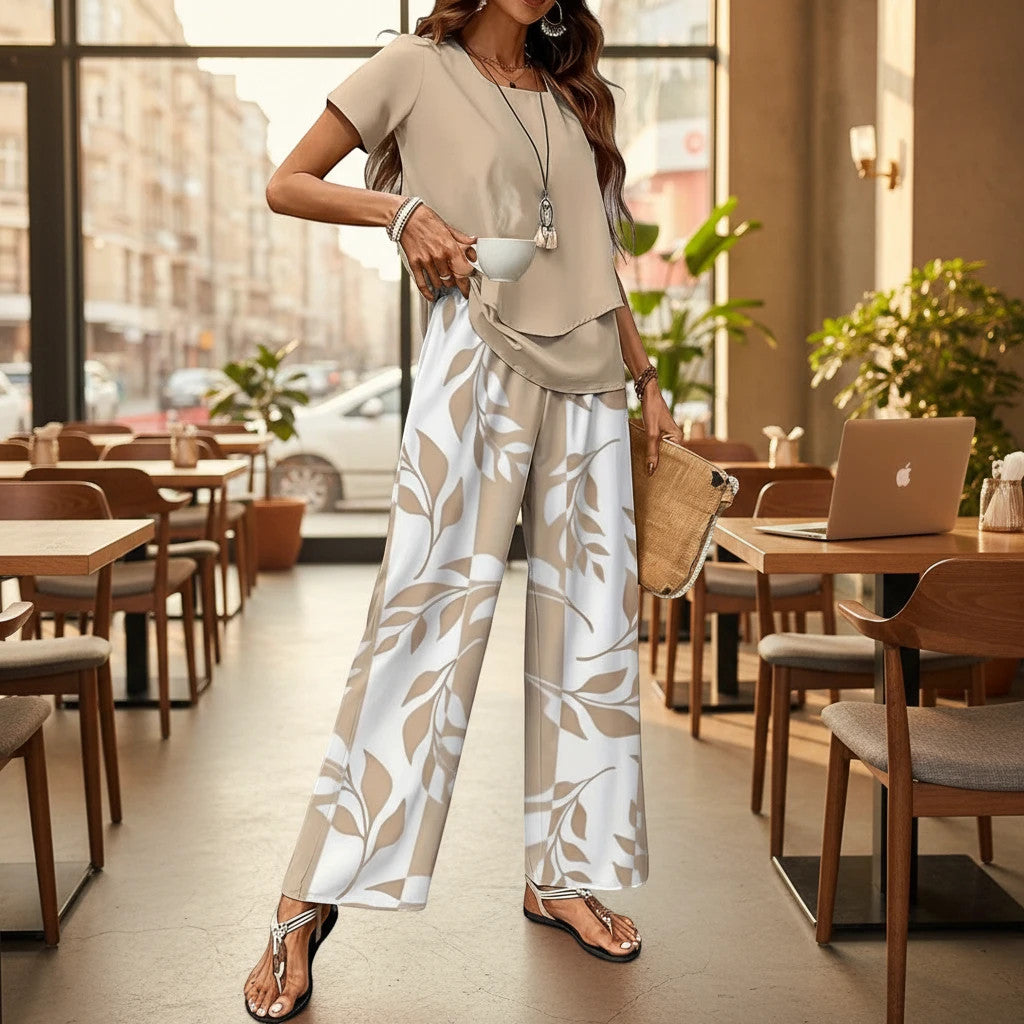 ZOFIA ATELIER women's beige top and wide-leg pants set with a beige and white leaf print. Three-quarter sleeves.