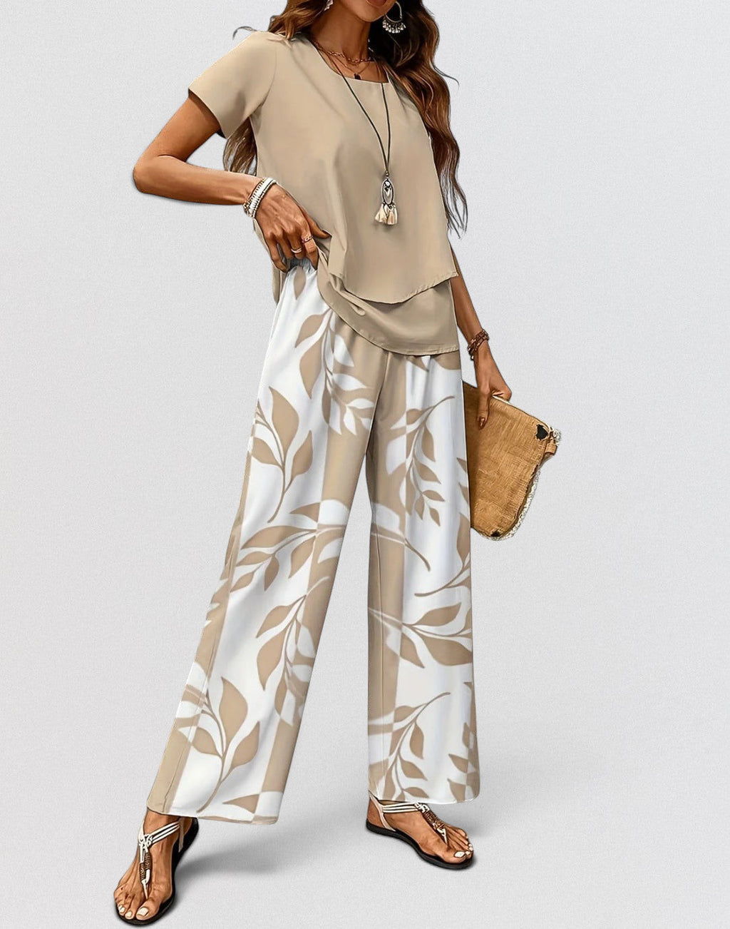ZOFIA ATELIER beige top and white pants set with beige leaf print. Polyester. Three-quarter sleeves.