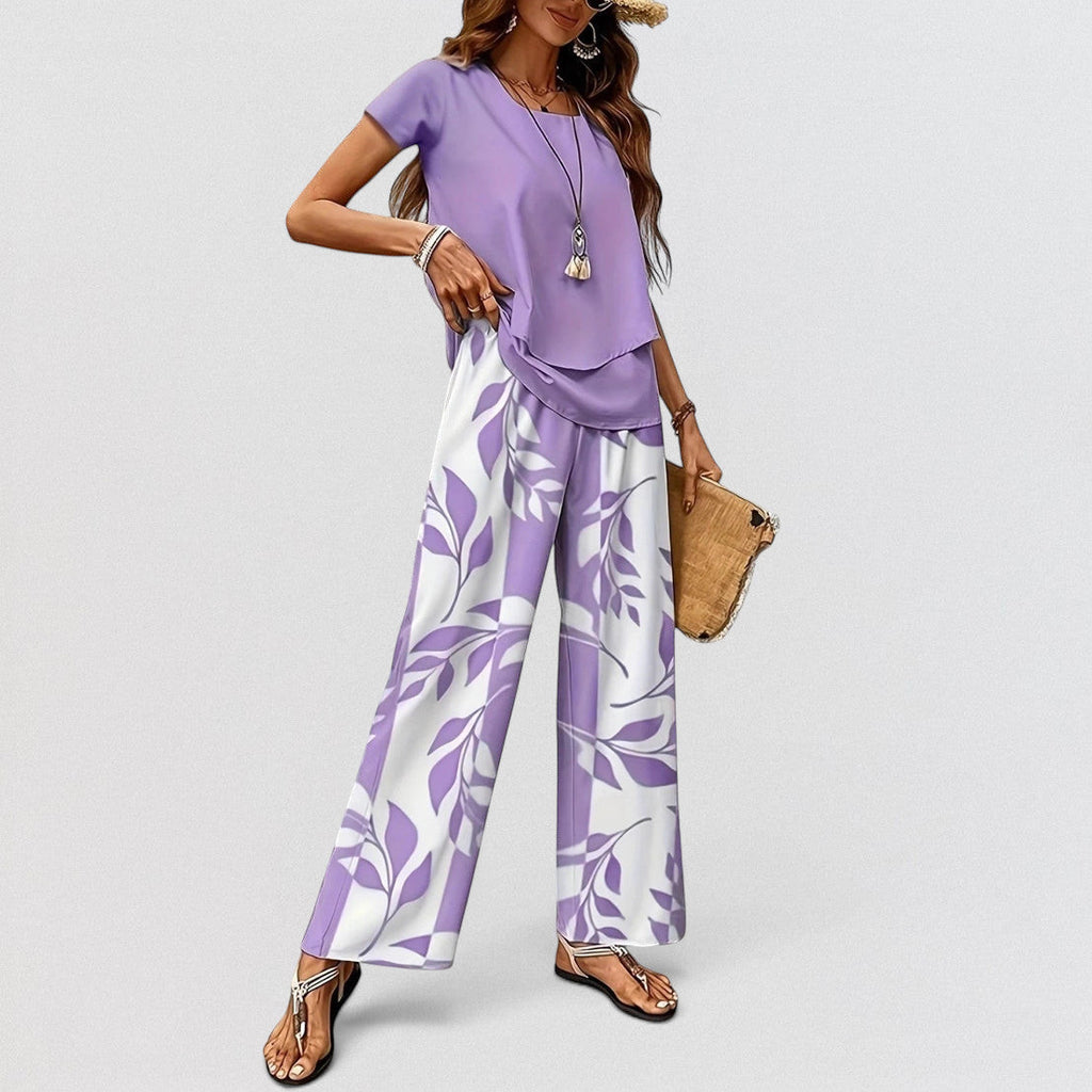 ZOFIA ATELIER purple top and white pants set with purple leaf print, three-quarter sleeves, full length wide-leg pants.