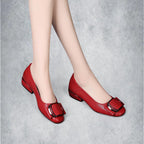 ZOFIA ATELIER red square-toe PU leather slip-on shoes with decorative buckle detail.