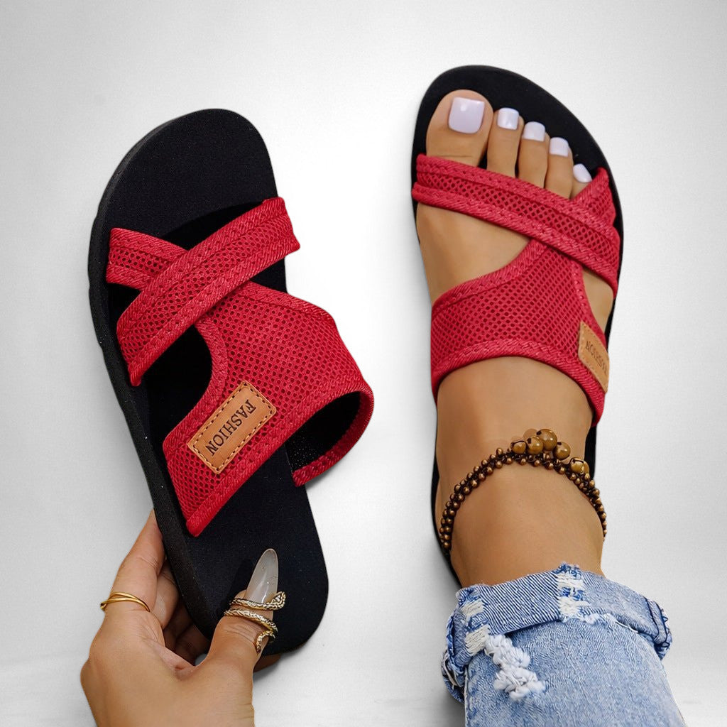 ZOFIA ATELIER Helena red mesh fabric slip-on slippers with criss-cross straps and black sole.