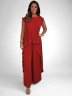 ZOFIA ATELIER red pleated short sleeve suit with wide leg pants, polyester fabric, flowing silhouette.
