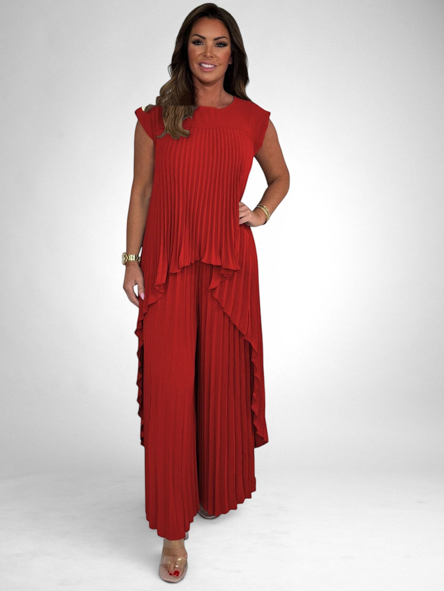 ZOFIA ATELIER red pleated short sleeve suit with wide leg pants, polyester fabric, flowing silhouette.