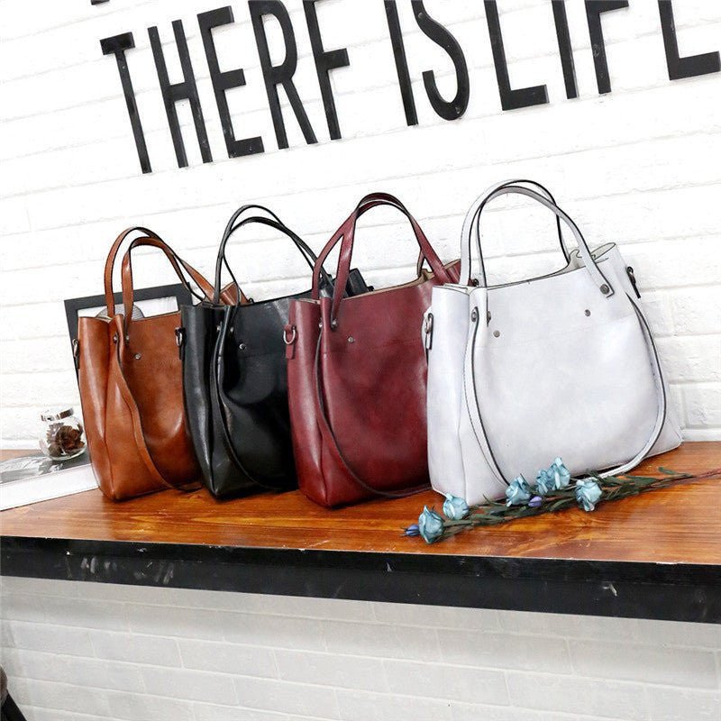 ZOFIA ATELIER medium red PU bucket bag with zipper closure and soft handles, retro-inspired design.