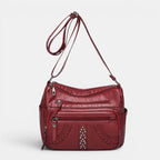 ZOFIA ATELIER red PU multi-layer crossbody bag with braided detail and studs