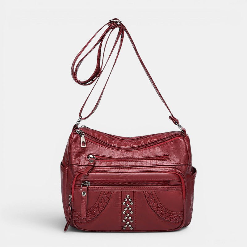 ZOFIA ATELIER red PU multi-layer crossbody bag with braided detail and studs