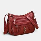 ZOFIA ATELIER red multi-layer PU crossbody bag with braided detail and studs