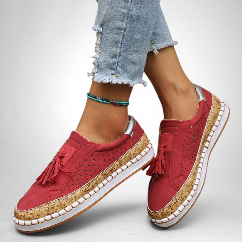 ZOFIA ATELIER red artificial PU tassel round toe flats with perforated detail and cork-effect sole.