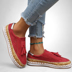 ZOFIA ATELIER red artificial PU tassel round toe flats with perforated details and cork-like sole.