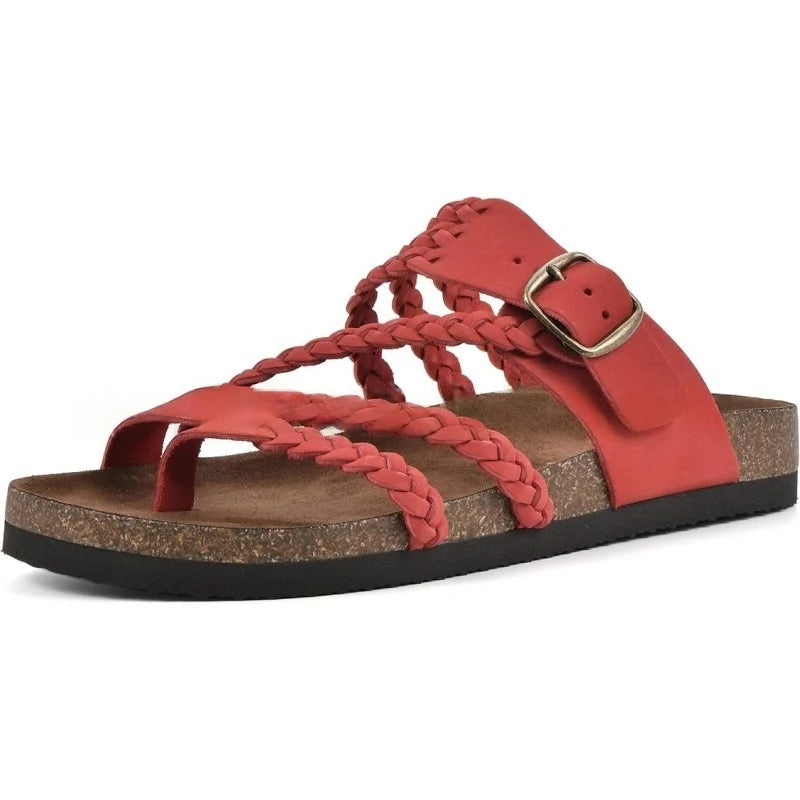 Red sandal with braided straps and a buckle on a white background