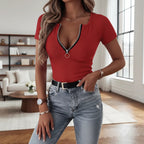 ZOFIA ATELIER red ribbed crewneck tee with zipper trim and short sleeves, paired with jeans.