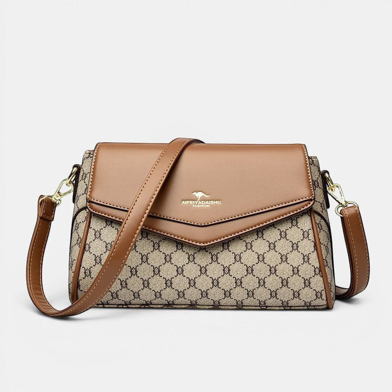 ZOFIA ATELIER Renata crossbody bag in brown PU with patchwork stitching and horizontal rectangular shape.