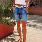 ZOFIA ATELIER RENATA high-waist denim crop shorts with rolled hem and button fly. Light blue wash.