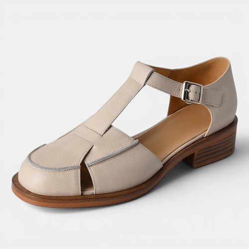ZOFIA ATELIER creamy-white leather retro flat sandals with T-strap and buckle closure.