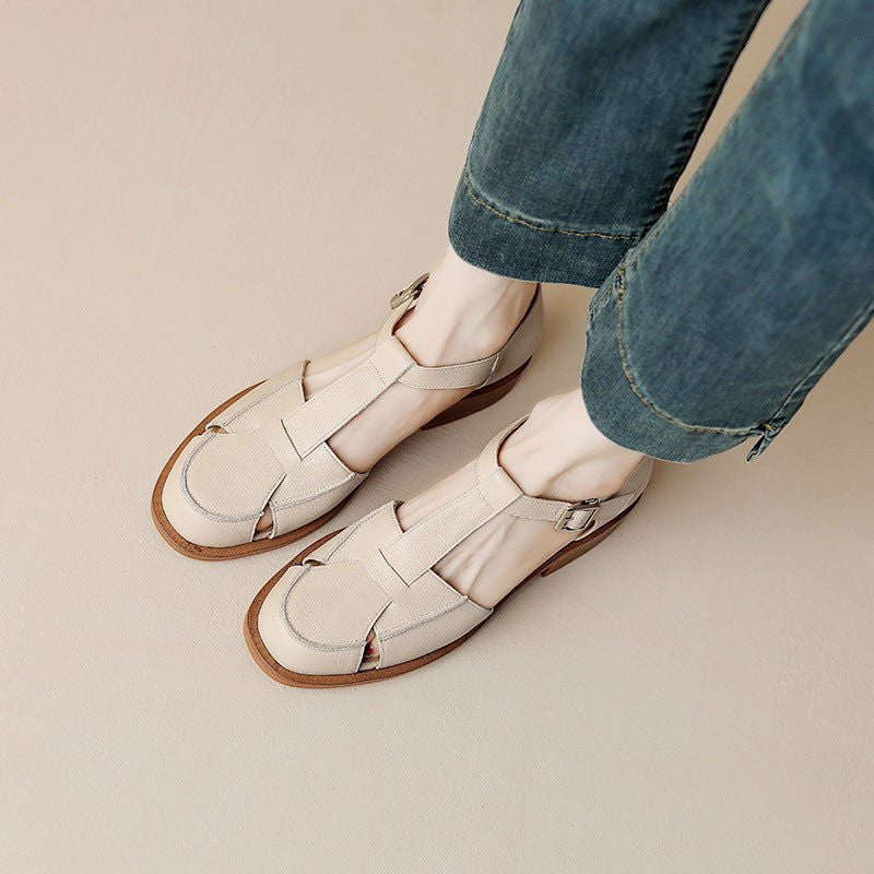 ZOFIA ATELIER creamy-white leather retro flat sandals with buckle closure and round toe.