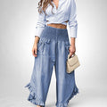 ZOFIA ATELIER light blue long sleeve crop top and wide leg denim pants with ruffled hems and smocked waist