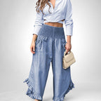 ZOFIA ATELIER light blue long sleeve crop top and wide leg denim pants with ruffled hems and smocked waist