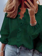 ZOFIA ATELIER Ewa dark green ruffled long sleeve blouse with split collar, paired with jeans.