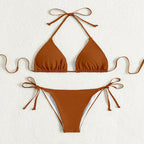 ZOFIA ATELIER rust-colored polyester bikini with halter top and tie-side bottoms. Features ruched detailing on the bust.