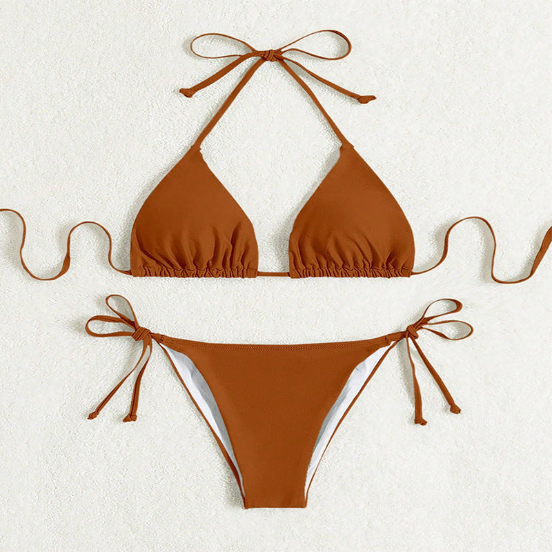 ZOFIA ATELIER rust-colored polyester bikini with halter top and tie-side bottoms. Features ruched detailing on the bust.