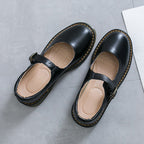ZOFIA ATELIER SABINA black microfiber low-cut flat shoes with buckle closure and yellow stitching.