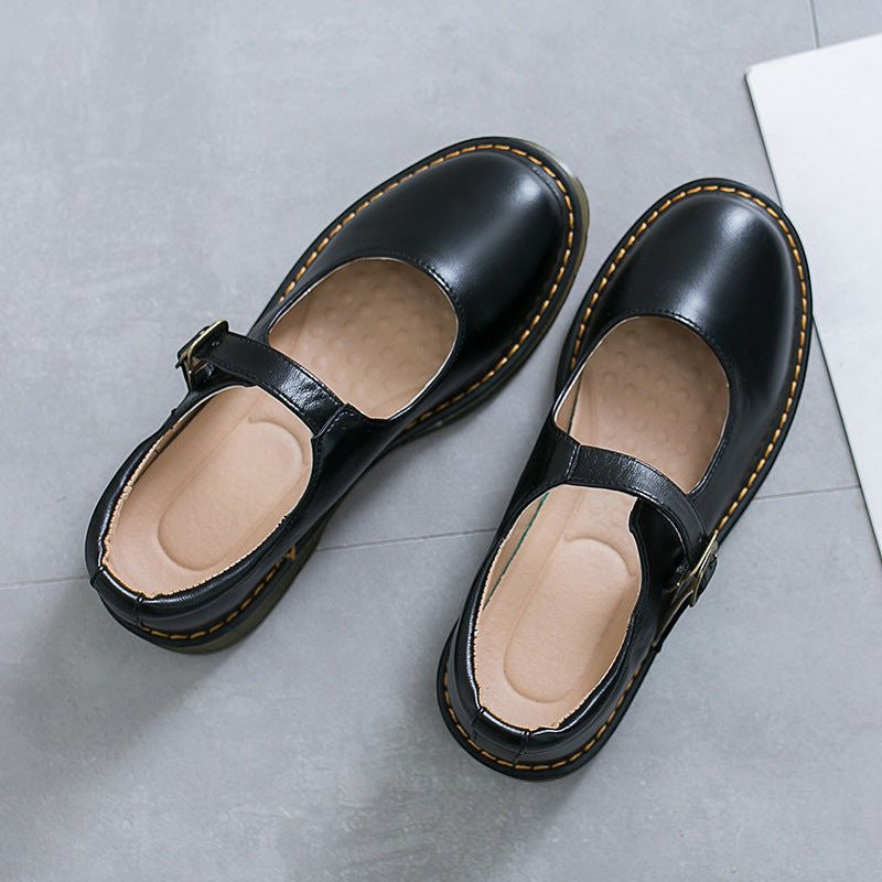 ZOFIA ATELIER SABINA black microfiber low-cut flat shoes with buckle closure and yellow stitching.