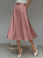 ZOFIA ATELIER dusty rose satin mid-length A-line skirt with pockets and slight stretch.